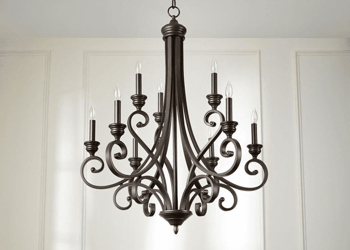 traditional candle style chandelier in bronze with crystal drops